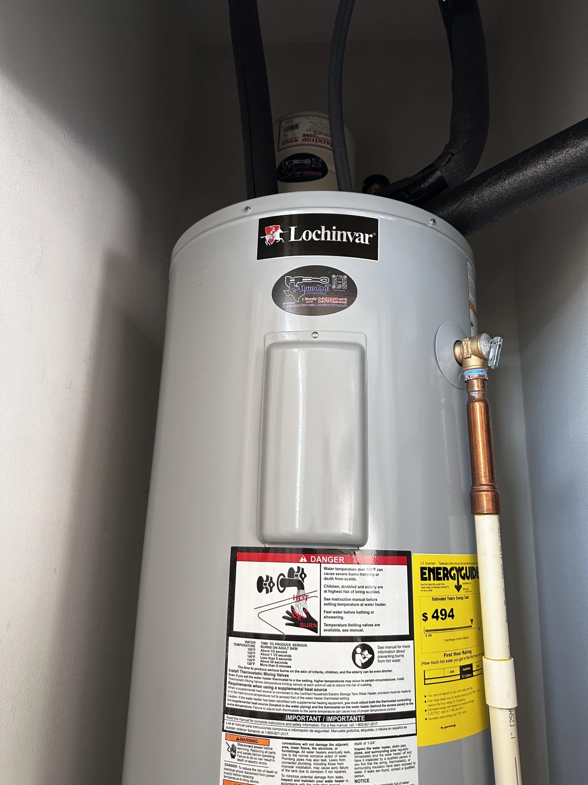 Tank-style water heater installed by Abundant Plumbing